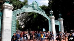 FILE - In this Aug. 15, 2017, photo, students walk on the University of California, Berkeley campus in Berkeley, Calif. 