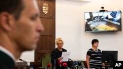 Judge Dr. Leona Németh delivers a verdict on the case of the captain of a river cruise boat in Budapest, Sept. 26, 2023. Yuriy Chaplinsky, the captain of a boat that collided with another vessel in Hungary's capital in 2019 was found guilty of negligence