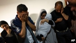 Members of the Abu Draz family mourn their relatives killed in the Israeli bombardment of the Gaza Strip, at their house in Rafah, southern Gaza, April 4, 2024.