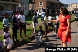 Mayor Indya Kincannon visits with members of the Lonsdale neighborhood during a homecoming celebration Saturday, Aug. 5, 2023 in Knoxville, Tenn. (AP Photo/George Walker IV)