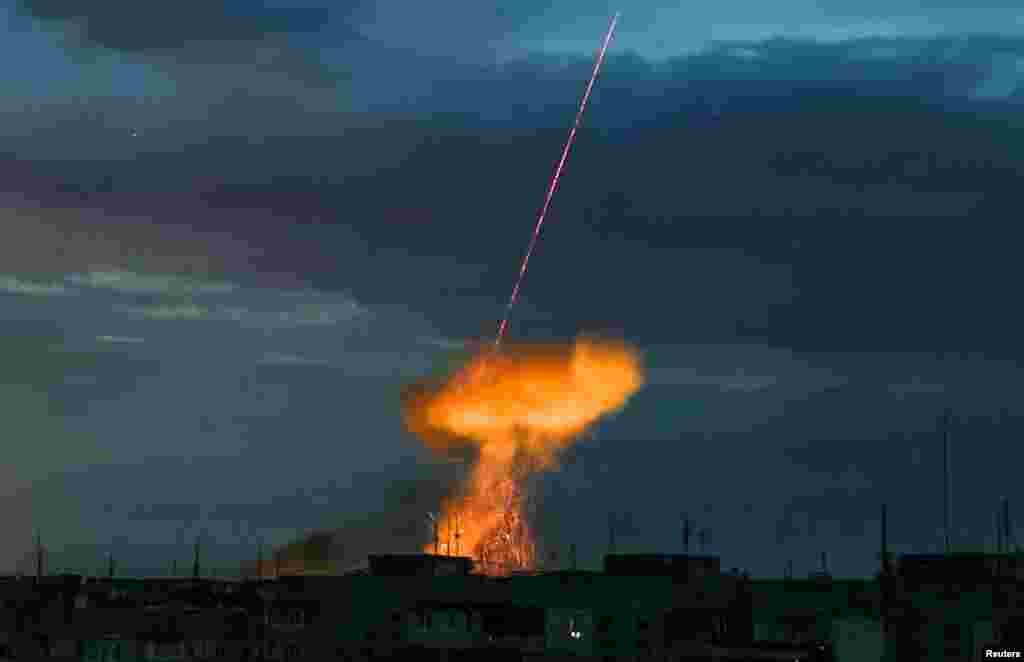 A explosion is seen as a Russian drone is shot down, amid Russia's attack on Ukraine, in Kherson, Ukraine.