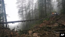 A portion of the Shimla-Kalka heritage railway track is washed away following heavy rainfall on the outskirts of Shimla, Himachal Pradesh state, Aug.14, 2023. 