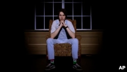 Grayson Hart sits for a portrait at the Ned R. McWherter West Tennessee Cultural Arts Center in Jackson, Tennessee, on Saturday, March 4, 2023. Hart was accepted into every college he applied to, but turned them down. He now directs a youth theater program.