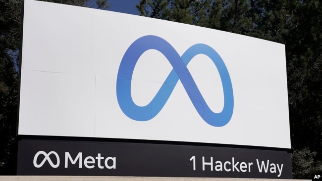 FILE - Facebook's Meta logo sign is seen at the company headquarters in Menlo Park, Calif., Oct. 28, 2021. European Union hits Facebook parent Meta with record $1.3 billion fine over transfers of user data to US.