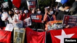 FILE - Myanmar protesters residing in Japan rally to mark the second anniversary of Myanmar's 2021 military coup, outside the Embassy of Myanmar in Tokyo, Feb. 1, 2023. 