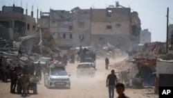 Palestinians displaced by the Israeli air and ground offensive on the Gaza Strip flee from parts of Khan Younis following an evacuation order by the Israeli army to leave the eastern part of Gaza Strip's second largest city, July 22, 2024. 