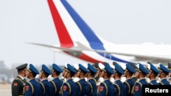 Chinese military officers stand in formation ahead of French President Emmanuel Macron's arrival at Beijing Capital International Airport, in Beijing, Apr. 5, 2023. 