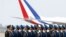 Chinese military officers stand in formation ahead of French President Emmanuel Macron's arrival at Beijing Capital International Airport, in Beijing, Apr. 5, 2023. 