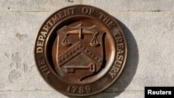 FILE - A bronze seal for the Department of the Treasury is shown at the U.S. Treasury building in Washington, Jan. 20, 2023. 