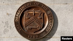 FILE - A bronze seal for the Department of the Treasury is displayed at the U.S. Treasury building in Washington, Jan. 20, 2023. 