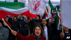 Demonstrators march past the U.S. Capitol in Washington during a Dec. 17, 2022, rally and vigil in solidarity with rallies in Iran 