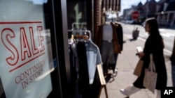 A shop holds a sidewalk sale during an unseasonably warm day, Friday, Feb. 10, 2023, in Providence, R.I. On Wednesday, the Commerce Department releases U.S. retail sales data for January.