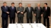 FILE - Officials from Japan, Kyrgyzstan, Turkmenistan, Kazakhstan, Tajikistan and Uzbekistan join hands at a Central Asia + Japan session in Tokyo, Nov. 9, 2012. The nations will hold their inaugural summit in Astana, Kazakhstan, beginning Aug. 9, 2024.