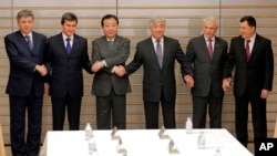 FILE - Officials from Japan, Kyrgyzstan, Turkmenistan, Kazakhstan, Tajikistan and Uzbekistan join hands at a Central Asia + Japan session in Tokyo, Nov. 9, 2012. The nations will hold their inaugural summit in Astana, Kazakhstan, beginning Aug. 9, 2024.