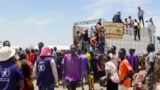 FILE: People who crossed from Sudan are seen at a refugee camp in Renk County, South Sudan, on Wed. May 3, 2023.