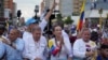 Presidential candidate Edmundo Gonzalez, second from left, and opposition leader Maria Corina Machado, second from right, attend a campaign rally in Maracaibo, Venezuela, July 23, 2024. The presidential election is set for July 28.