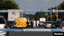 Police work at the scene where a man was arrested after people were stabbed in Southport, Britain, July 29, 2024.