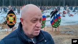 FILE: Wagner Group head Yevgeny Prigozhin attends the a Wagner Group mercenary killed while supporting Moscow's attack upon Ukraine, at the Beloostrovskoye cemetery outside St. Petersburg, Russia, on Dec. 24, 2022. Wagner is using prison convicts to take bullets in Ukraine.