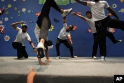 In this photo taken July 22, 2010, Palestinian members of the Camps Breakerz breakdancing at a children's center in Gaza City. (AP Photo/Tara Todras-Whitehill, file)