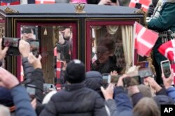 Denmark's Queen Margrethe II arrives at Christiansborg Palace in Copenhagen, Jan. 14, 2024.