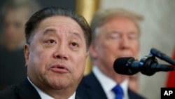 FILE - Broadcom CEO Hock Tan speaks as President Donald Trump listens during an event on Nov. 2, 2017 in Washington. Tan topped the AP survey of CEO pay with a package valued at about $162 million in 2023.
