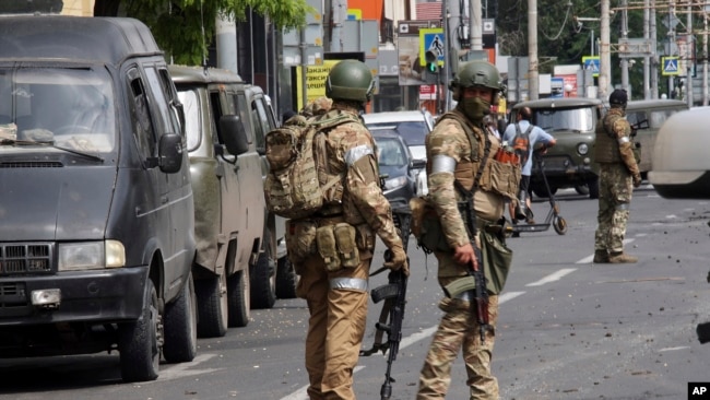 Russian servicemen guard an area in a street in Rostov-on-Don, Russia, June 24, 2023.