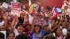 Supporters of Venezuelan President Nicolas Maduro attend at a campaign rally in the Catia neighborhood of Caracas, Venezuela, July 18, 2024. 