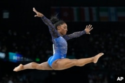 Simone Biles of the United States performs on the balance beam during the women's artistic gymnastics all-around finals in Bercy Arena at the 2024 Summer Olympics in Paris, Aug. 1, 2024.