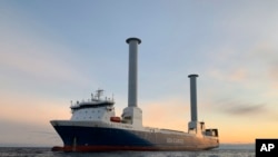 FILE - 2021 photo of the SC Connector, a freight-hauling vessel owned by the Norwegian company Sea-Cargo. The ship has two rotor sails made by Finland-based Norsepower.