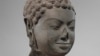This December 2005 photo shows a 7th century sculpture titled "Head of Buddha" at the Metropolitan Museum of Art in New York. The sculpture is one of 16 pieces of artwork that the museum said it will return to Cambodia and Thailand. (Metropolitan Museum of Art via AP)