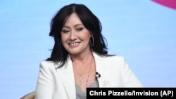 FILE - Shannen Doherty participates in Fox's "BH90210" panel at the Television Critics Association Summer Press Tour, Aug. 7, 2019, in Beverly Hills, California.