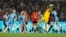 Spain's goalkeeper Cata Coll, second from right, makes a save during the final of Women's World Cup soccer between Spain and England at Stadium Australia in Sydney, Aug. 20, 2023. 
