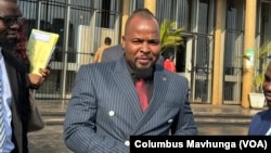 Agency Gumbo, a member of parliament for the Citizens’ Coalition for Change, or Triple C, tells reporters that party members had been ill-treated by the police, in Harare on June 18, 2024.