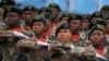 FILE - Members of the presidential guard march during the Armed Forces Day in Richards Bay, South Africa, on Feb. 21, 2023. The parade took place as a naval exercise was underway off the east coast of the country with Russian and Chinese navies.