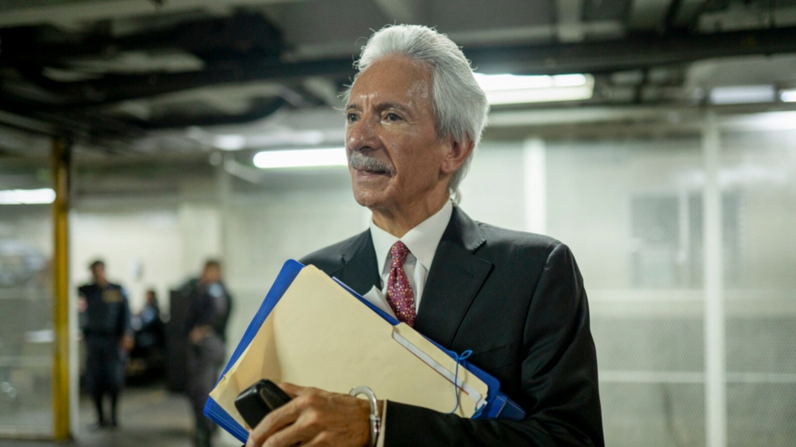 FILE - Newspaper founder Jose Ruben Zamora leaves in handcuffs after a court hearing in Guatemala City, June 14, 2023. 