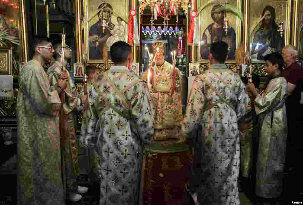 Greek Orthodox Patriarchate Archbishop Alexios of Tiberias attends an Orthodox Easter mass at the Greek Orthodox Saint Porphyrius Church, amid the ongoing conflict between Israel and Hamas, in Gaza City, May 5, 2024.