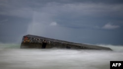This photograph shows a partially submerged bunker (Blockhaus) from the Atlantic Wall at the entrance of Arcachon Bay near Cap Ferret, south-western France. The Atlantic Wall, made up of bunkers or blockhaus was ordered by Nazi Germany's leader Adolf Hitler to be built between 1942 and 1944, stretched some 5000km from northern Norway to the Franco-Spanish border to defend occupied territories from sea borne attack. 