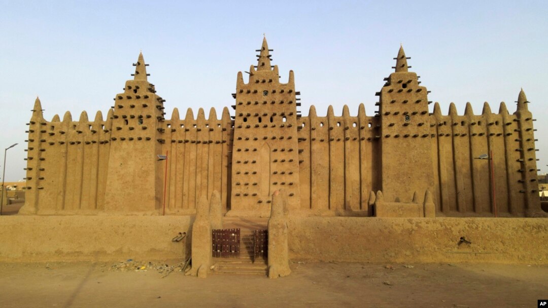FILE- The world's largest mud-brick building, the Great Mosque of Djenne, Mali, awaits its annual replastering, May 10, 2024. 