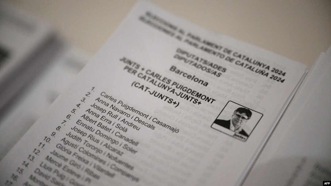 Carles Puigdemont's Junts per Catalunya (Together for Catalonia) separatist party list is pictured at a polling station in La Roca del Valles on May 12, 2024, during Catalonia's regional elections. 