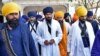 FILE - Amritpal Singh, a separatist Sikh leader, leaves the holy Sikh shrine of the Golden Temple along with his supporters, in Amritsar, India, March 3, 2023.