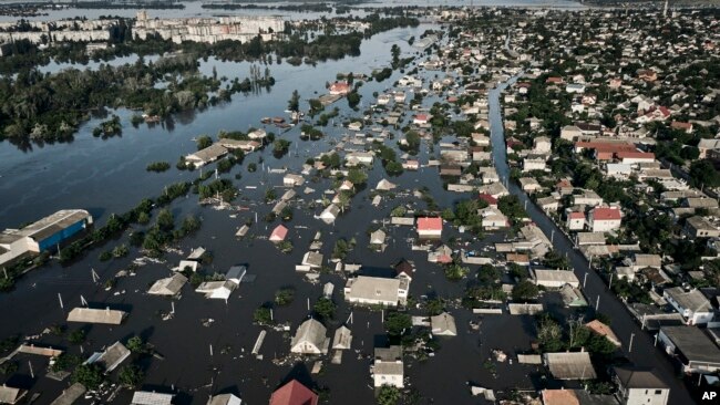 Streets are flooded in Kherson, Ukraine, Wednesday, June 7, 2023 after the walls of the Kakhovka dam collapsed.