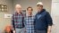 Mohammad Hussain Musawi, center, stands with his flight instructor, left, and Darin Chung, of the Afghan American Development Group, in Independence, Oregon, on April 7, 2023. Musawi and two other men died when a plane he was piloting crashed Dec. 16, 2023. (Nikki Chung via AP)
