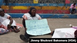 Umwe mu bagore bakoze imyigaragambyo i Goma muri Repubulika ya demokarasi ya Kongo yamagana ihohoterwa rishingiye ku gitsina. Photo: Jimmy Shukrani Bakomera/ VOA 03/01/2024