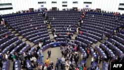 FILE - Members of the European Parliament line up to vote in the election of the new President of the European Parliament during the first plenary session of the newly-elected European Assembly in Strasbourg, eastern France, on July 16, 2024.