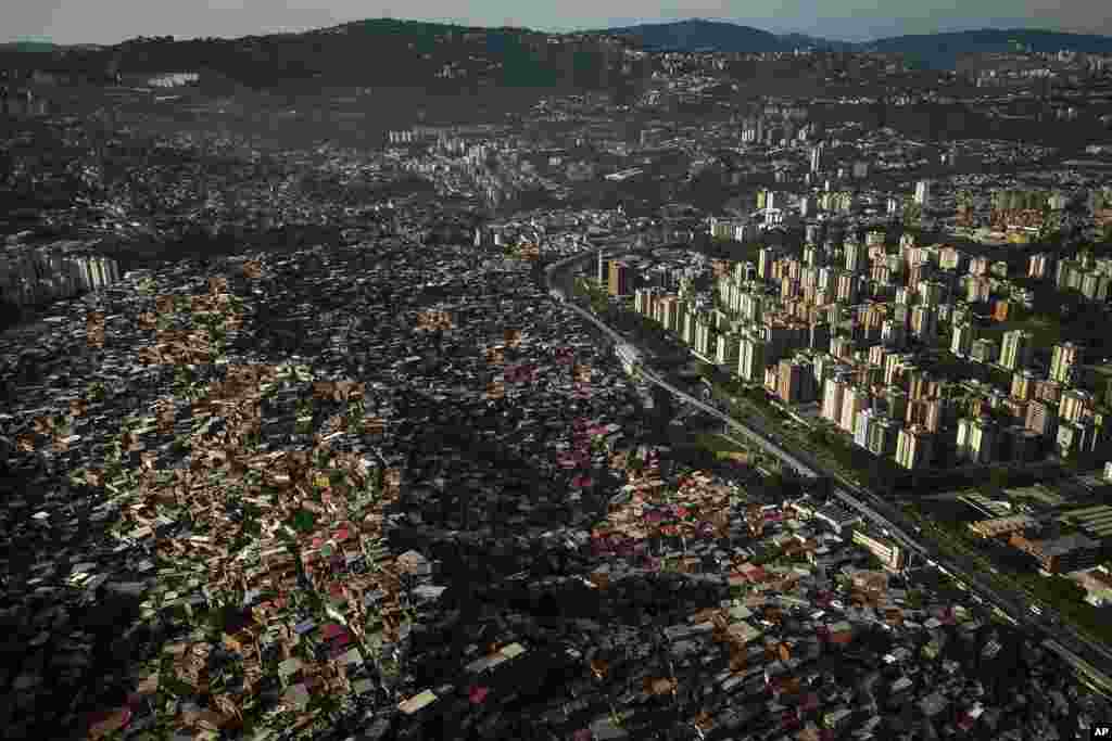 Homes cover a hill in the Petare neighborhood of Caracas, Venezuela.