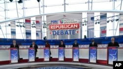 FILE - From left, North Dakota Gov. Doug Burgum, former New Jersey Gov. Chris Christie, former UN Ambassador Nikki Haley, Florida Gov. Ron DeSantis, entrepreneur Vivek Ramaswamy, Sen. Tim Scott, R-SC, and former Vice President Mike Pence, debate Sept. 27, 2023.