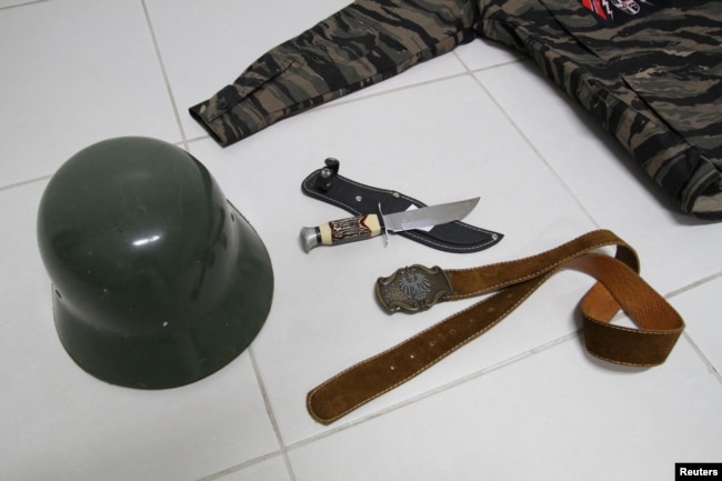 Items seized from a neo-Nazi group who call themselves Crew 38 are displayed in Florianopolis, Santa Catarina state, Brazil April 24, 2023. (REUTERS/Cristiano Estrela)