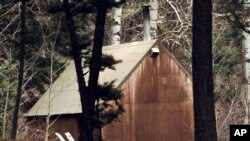 FILE - This April 6, 1996 photo shows Ted Kaczynski's cabin in the woods of Lincoln, Mont. Kaczynski, known as the “Unabomber,” has died in federal prison.