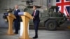 Britain's Prime Minister Rishi Sunak, right, and NATO Secretary General Jens Stoltenberg address a press conference at the Warsaw Armoured Brigade in Warsaw, Poland, April 23, 2024.