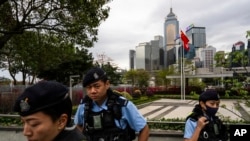 Police officers stand guard outside the Legislative Council in Hong Kong, March 19, 2024. 